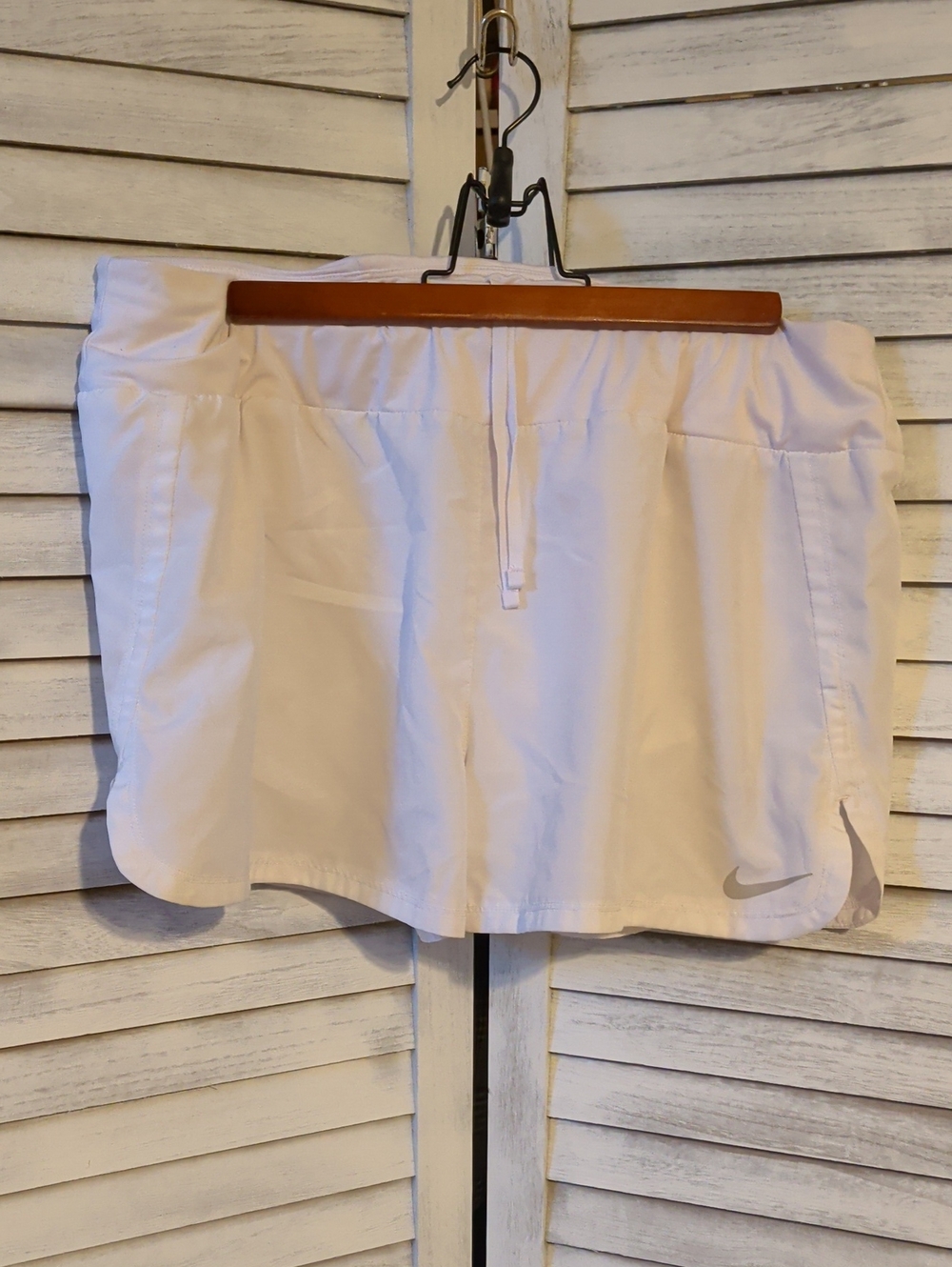 Nike Women's White Athletic Shorts with Silver Swoosh